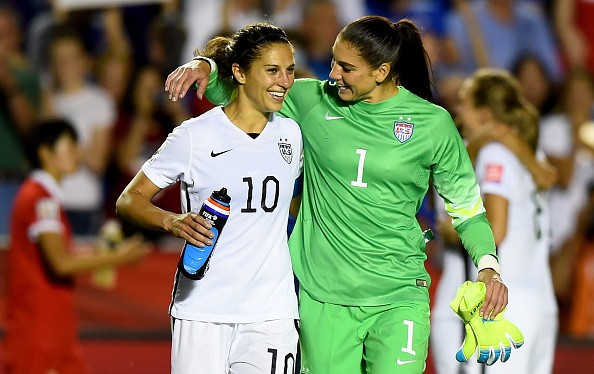 Carli Lloyd of USA celebrates with Hope Solo of USA after winning the FIFA Women's World Cup 2015 Quarter Final match