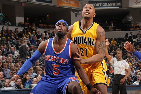 Tim Hardaway Jr. #5 of the New York Knicks boxes out against David West #21 of the Indiana Pacers