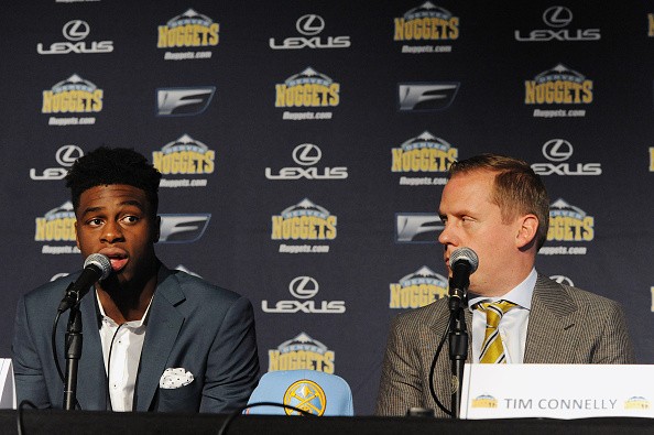 The seventh selection in the 2015 NBA Draft Emmanuel Mudiay #0 and General Manager Tim Connelly 
