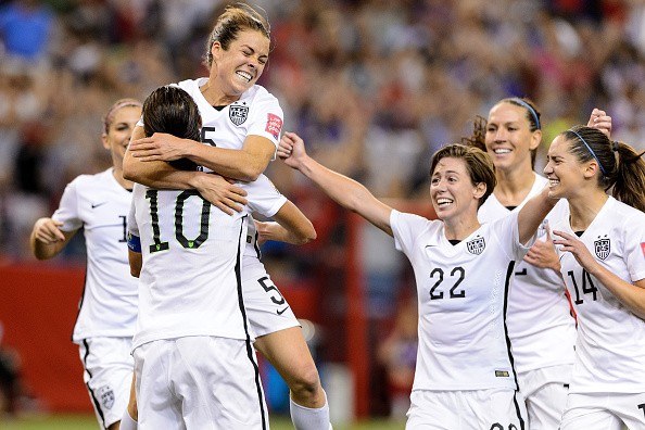Kelley O'Hara #5 of the United States celebrates with teammates after scoring a goal in the second half against Germany