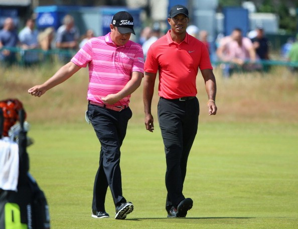 Jason Dufner (L) and Tiger Woods of the United States
