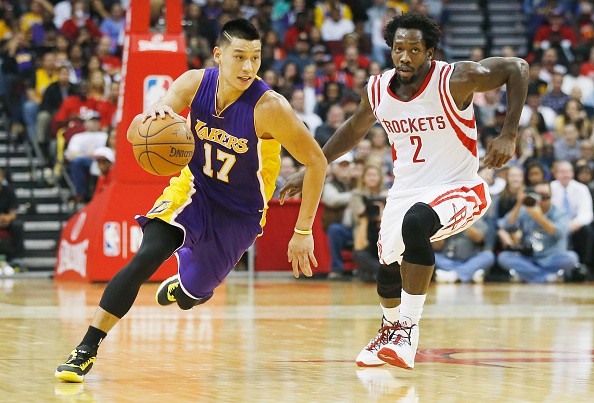 Jeremy Lin #17 of the Los Angeles Lakers drives with the ball against Patrick Beverley #2 of the Houston Rockets