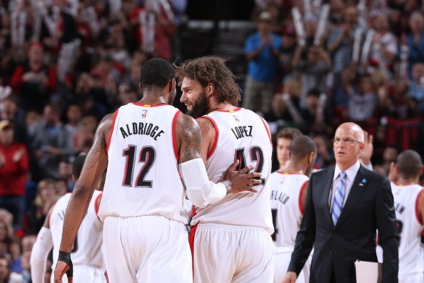 LaMarcus Aldridge #12 and Robin Lopez #42 of the Portland Trail Blazers celebrate during a game against the Phoenix Suns