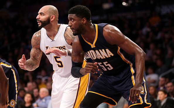 Roy Hibbert #55 of the Indiana Pacers and Carlos Boozer #5 of the Los Angeles Lakers