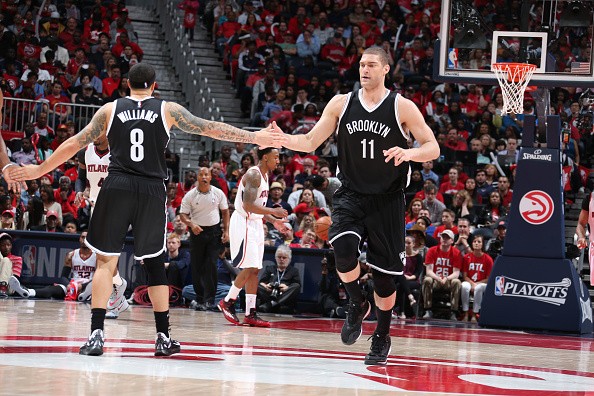 Brook Lopez #11 and Deron Williams #8 of the Brooklyn Nets 