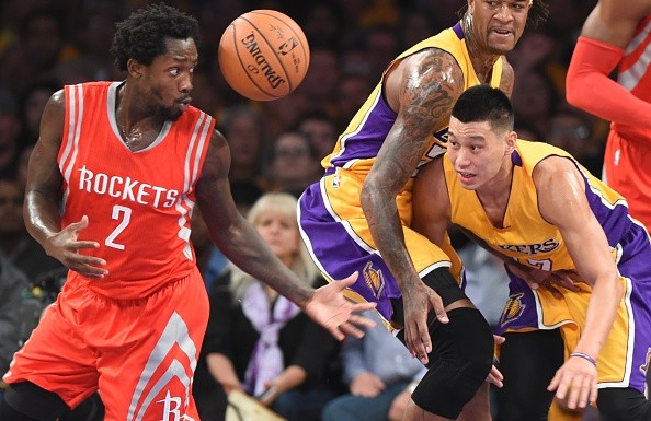 Jeremy Lin (R) of the Los Angeles Lakers vies for the ball with Patrick Beverley (L) of the Houston Rockets 