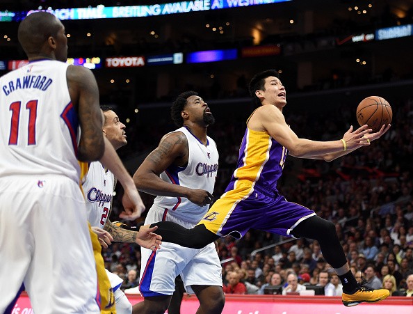 Jeremy Lin #17 of the Los Angeles Lakers is fouled by DeAndre Jordan #6 of the Los Angeles Clippers