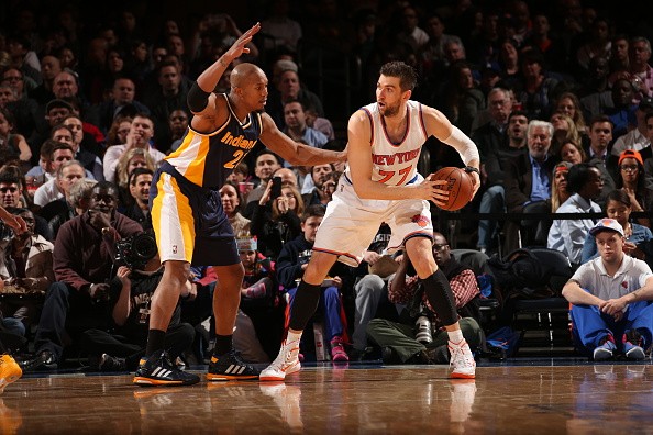 Andrea Bargnani #77 of the New York Knicks handles the ball against David West #21