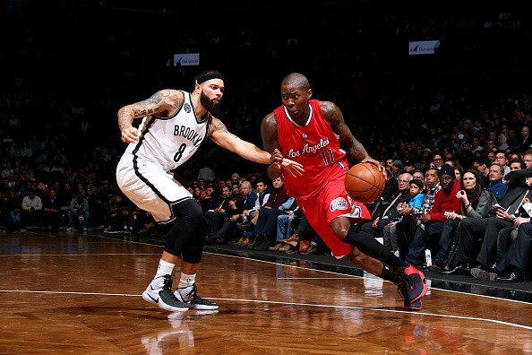 Jamal Crawford #11 of the Los Angeles Clippers drives against Deron Williams #8 of the Brooklyn Nets 