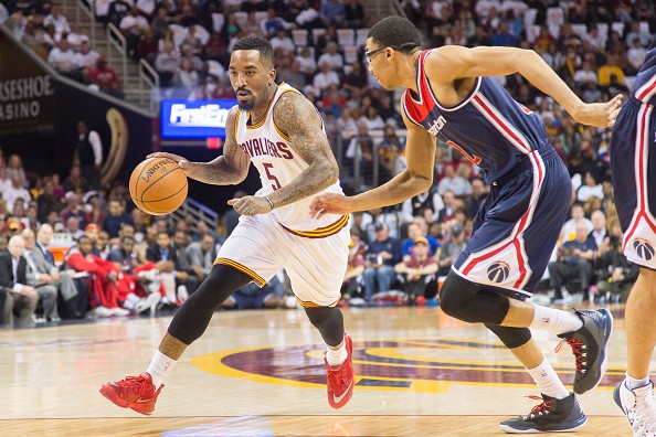J.R. Smith #5 of the Cleveland Cavaliers drives around Otto Porter Jr. #22 of the Washington Wizards