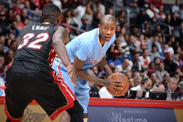 Jamal Crawford #11 of the Los Angeles Clippers defends the ball against James Ennis #32 of the Miami Heat 