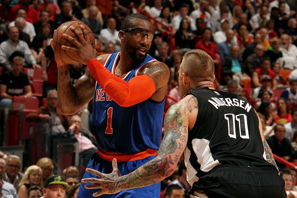 Amar'e Stoudemire #1 of the New York Knicks handles the ball against Chris Andersen of the Miami Heat