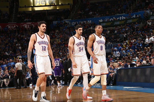Steven Adams #12 of the, Enes Kanter #34, and Russell Westbrook #0 of the Oklahoma City Thunder 