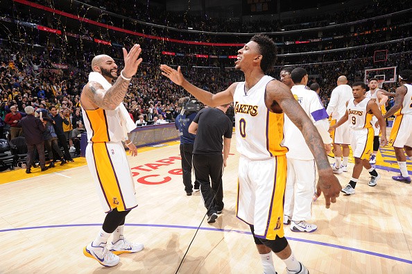 Robert Sacre #50 and Nick Young #0 of the Los Angeles Lakers 