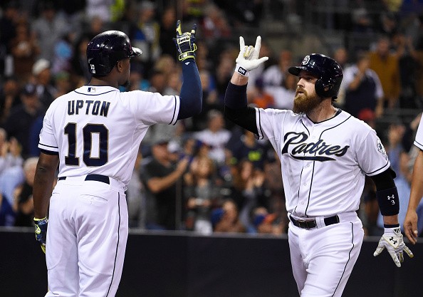 Derek Norris #3 of the San Diego Padres, right, is congratulated by Justin Upton #10