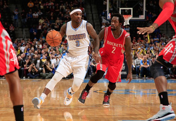 Ty Lawson #3 of the Denver Nuggets controls the ball against Patrick Beverley #2 of the Houston Rockets 