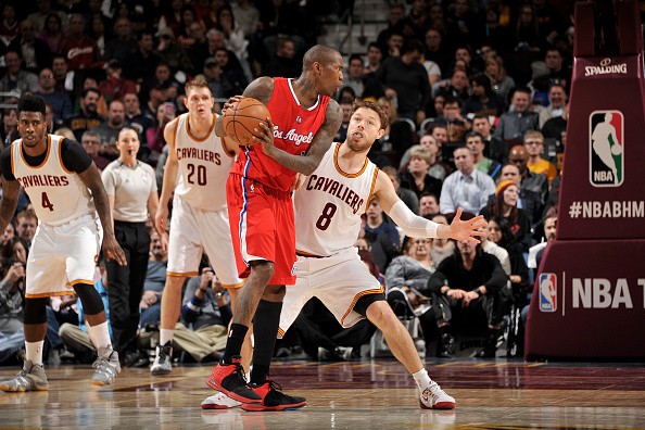 Jamal Crawford #11 of the Los Angeles Clippers handles the ball against Matthew Dellavedova #8 of the Cleveland Cavaliers
