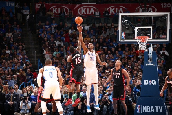 Mario Chalmers #15 of the Miami Heat and Kevin Durant #35 of the Oklahoma City Thunder