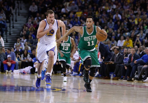 Evan Turner #11 of the Boston Celtics steals the ball from David Lee #10 of the Golden State Warriors 