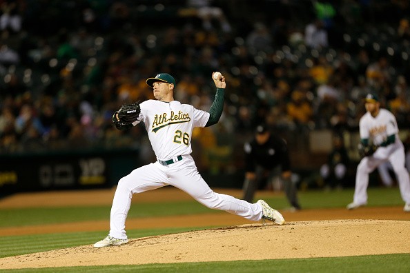 Scott Kazmir #26 of the Oakland Athletics pitches during the game against the Houston Astros