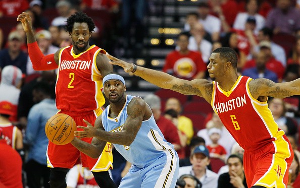 Ty Lawson #3 of the Denver Nuggets, Patrick Beverley and Terrence Jones #6 of the Houston Rockets 