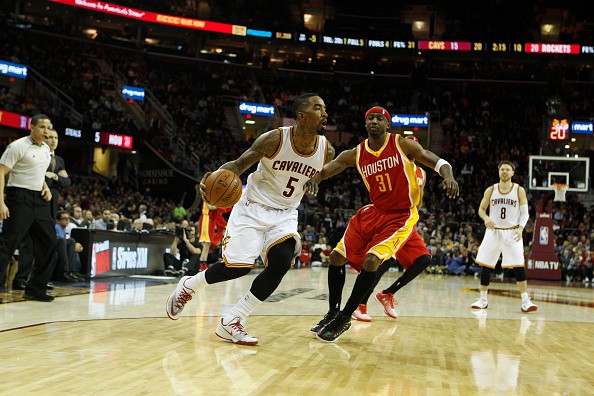 J.R. Smith #5 of the Cleveland Cavaliers drives against Jason Terry #31of the Houston Rockets