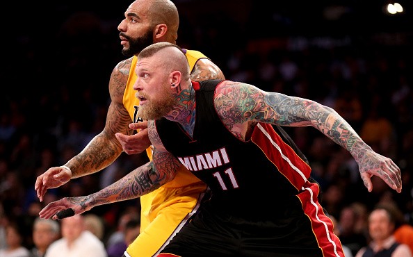 Chris Andersen #11 of the Miami Heat fights for position against Carlos Boozer #5 of the Los Angeles Lakers 
