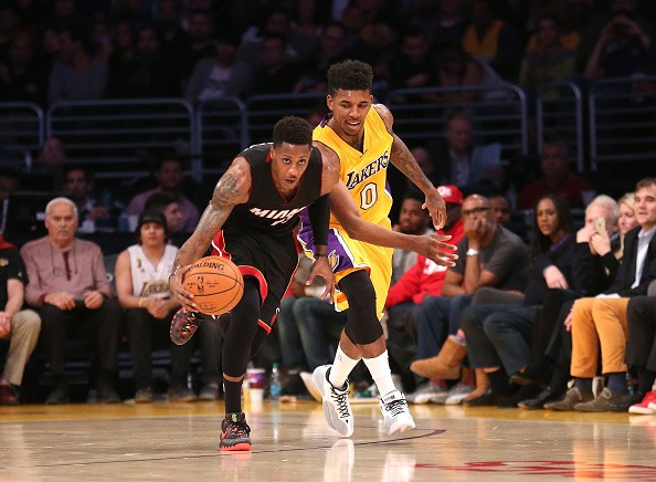 Mario Chalmers #15 of the Miami Heat steals the ball from Nick Young #0 of the Los Angeles Lakers 