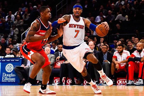 Carmelo Anthony #7 of the New York Knicks drives past Kevin Seraphin #13 of the Washington Wizards 