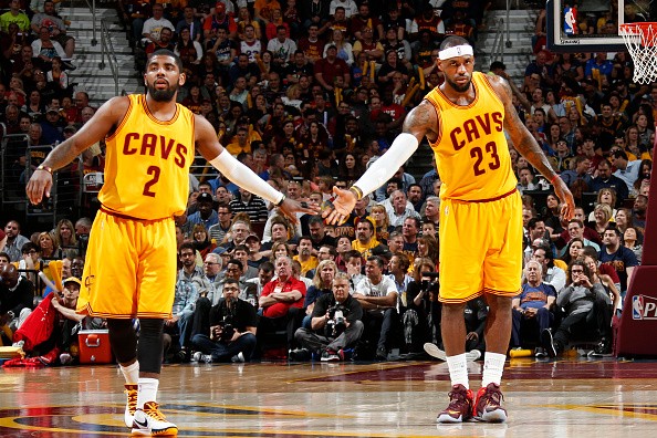 Kyrie Irving #2 high fives LeBron James #23 of the Cleveland Cavaliers 