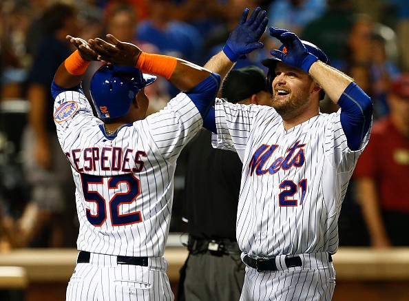 Lucas Duda #21 of the New York Mets is congratulated by Yoenis Cespedes #52 