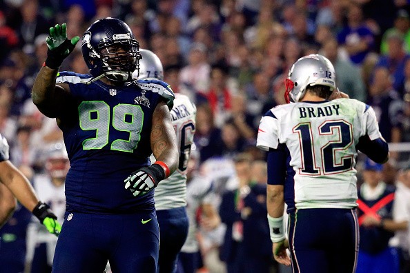 Tony McDaniel #99 of the Seattle Seahawks reacts after stopping the New England Patriots