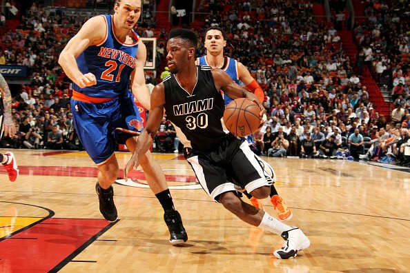 Norris Cole #30 of the Miami Heat drives against the New York Knicks 