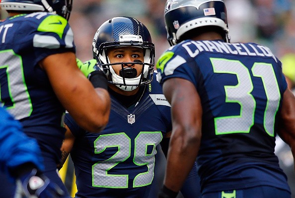 Free safety Earl Thomas #29 of the Seattle Seahawks celebrates with strong safety Kam Chancellor 