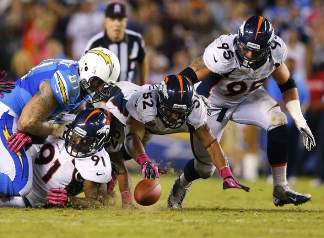 Broncos and Chargers Scramble for Fumble