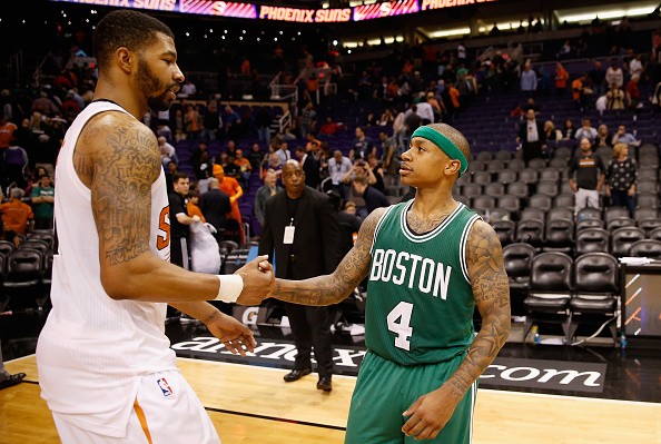 Isaiah Thomas #4 of the Boston Celtics greets former teammate Markieff Morris #11 of the Phoenix Suns 