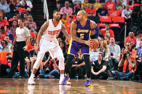 Markieff Morris #11 of the Phoenix Suns, Carlos Boozer #5 of the Los Angeles Lakers 