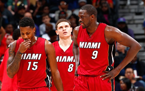 Mario Chalmers #15, Tyler Johnson #8 and Luol Deng #9 