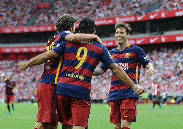 Luis Suarez of FC Barcelona celebrates with Lionel Messi 