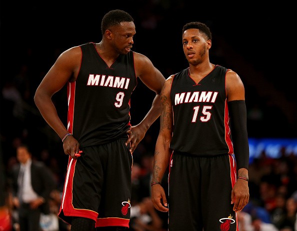 Luol Deng #9 and Mario Chalmers #15 of the Miami Heat 