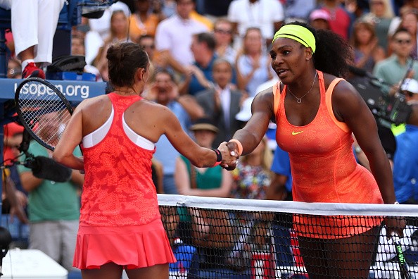 Roberta Vinci of Italy shakes hands with Serena Williams of the United States