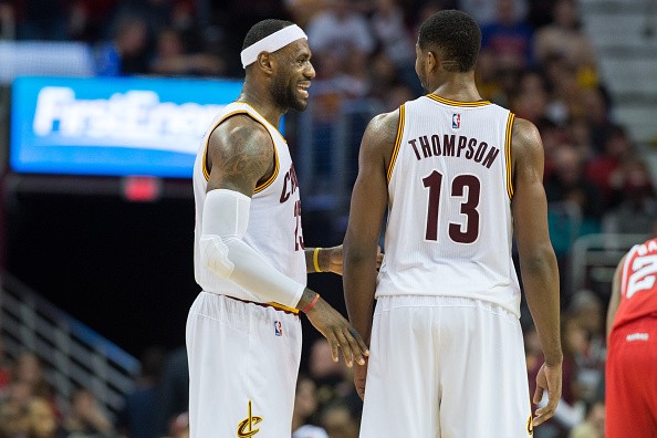 LeBron James #23 talks with Tristan Thompson #13 of the Cleveland Cavaliers