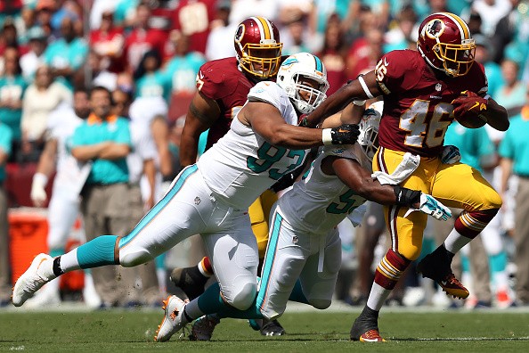 Running back Alfred Morris #46 of the Washington Redskins, Ndamukong Suh #93 of the Miami Dolphins 