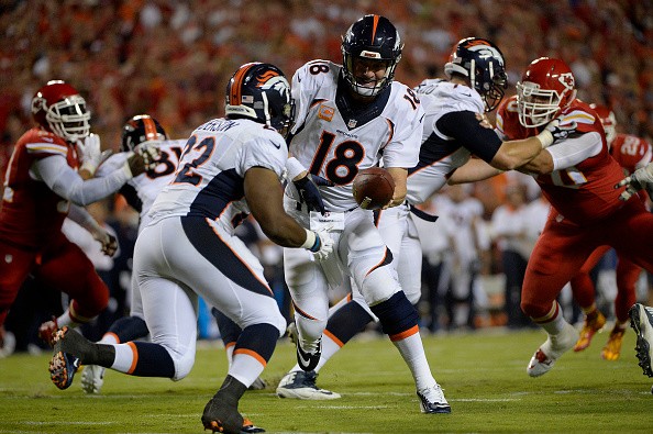 Quarterback Peyton Manning (18), C.J. Anderson of the Denver Broncos 