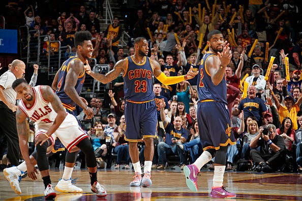LeBron James #23, Iman Shumpert #4 and Kyrie Irving #2 of the Cleveland Cavaliers