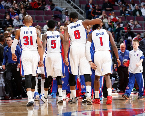 Kentavious Caldwell-Pope #5, Andre Drummond #0 and Reggie Jackson #1 of the Detroit Pistons 