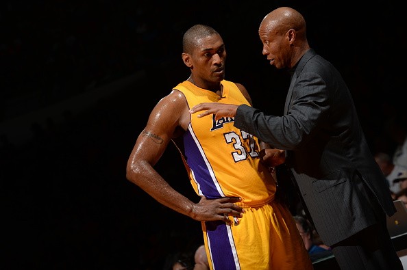Head Coach Byron Scott of the Los Angeles Lakers talks with Metta World Peace