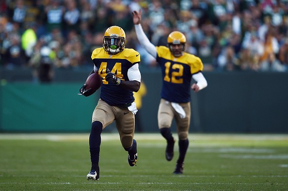 Aaron Rodgers #12 celebrates as James Starks #44 of the Green Bay Packers 