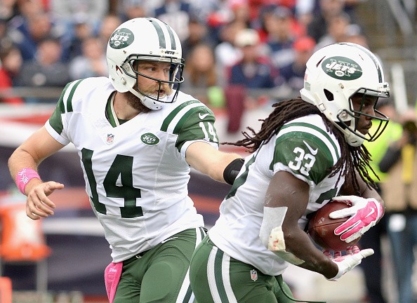 Ryan Fitzpatrick #14 hands the ball off to Chris Ivory #33 of the New York Jets