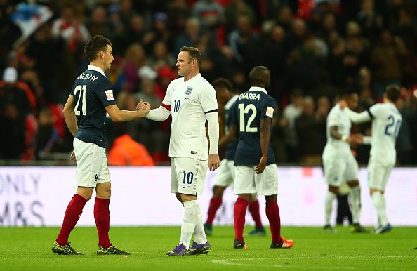 Wayne Rooney of England and Laurent Koscielny o